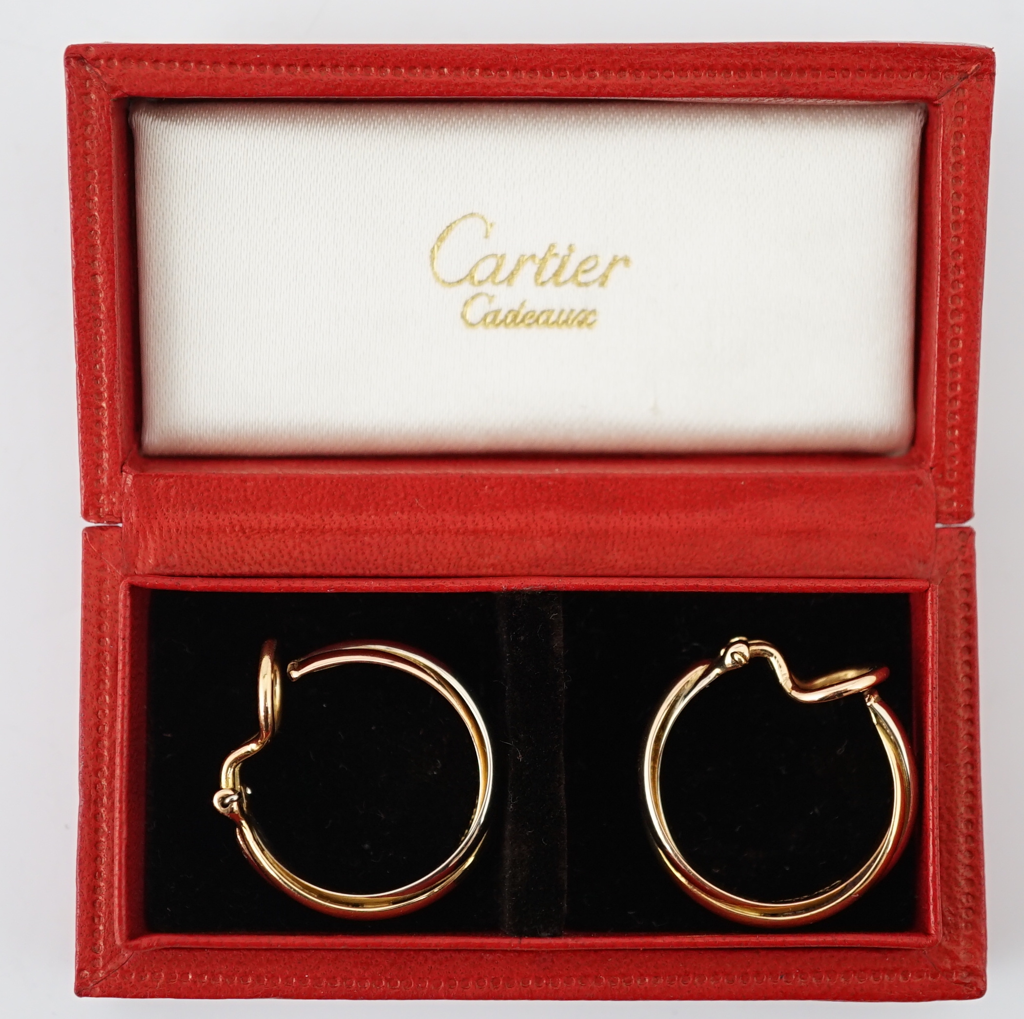A pair of French Cartier three colour 18ct gold interwoven hoop ear clips